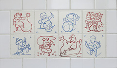 Eight white tiles, each with a red or blue line drawing of a child playing.  Four tiles wide by two tiles tall.  Jean Charlot.